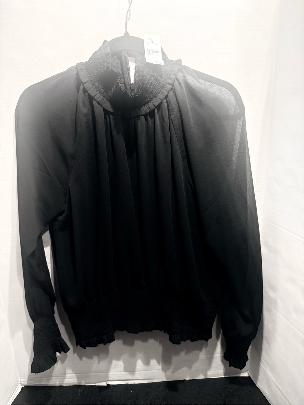 Ann Taylor Sheer black blouse
Size S 
Original $79.99
